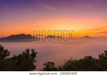 Mountains Under Mist In The Morning With Sunrise At Phutoke Loei Thailand