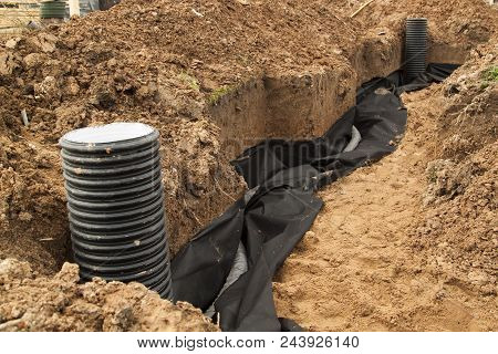 Laying Of Drainage Pipes And Inspection Well For Removal Of Water From A Site Under Construction Of 