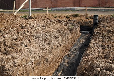 Laying Of Drainage Pipes And Inspection Well For Removal Of Water From A Site Under Construction Of 