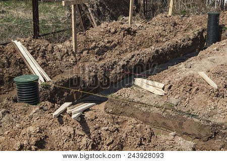 View Of Drainage Pipes And Inspection Well For Removal Of Water From A Site Under Construction Of Th