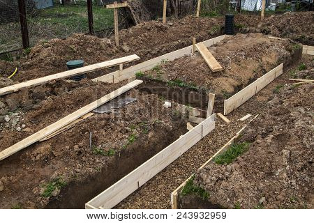 Inspection Wells, Drainage Pipes And Trench With Formwork, Which Is Prepared For Pouring The Foundat