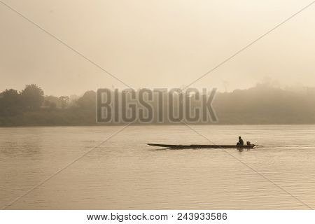 People Sails The Boat In The Sea During The Sunset