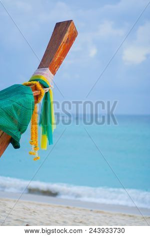 Thai Boat Lie On The Beach And It Ties With The Colorful Clothes.cr2