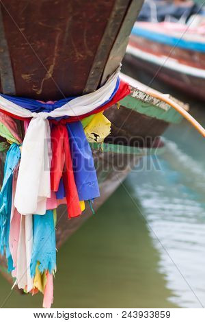 A Close Up Thai Boat Along With Colorful Clothes