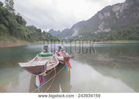 The Close Up Of 2 Thai Boats On The Coast