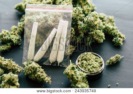 Rolled Jamb Joint In The Hands Of A Man Marijuana Weed And Grinder For Weed, Concepts Of Smoking Mar