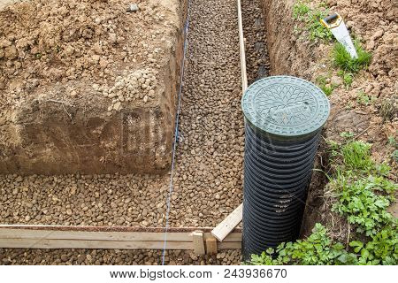 Inspection Well, Drainage Pipe And Trench With Formwork, Which Is Prepared For Pouring The Foundatio