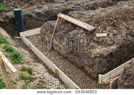Inspection Well, Drainage Pipe And Trench With Formwork, Which Is Prepared For Pouring The Foundatio