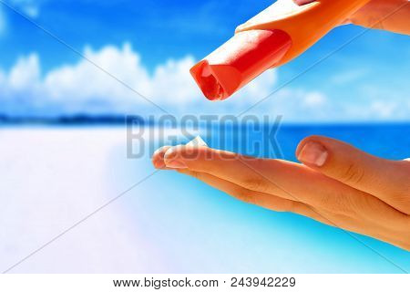 Woman Hands Putting Sunscreen From A Suncream Bottle