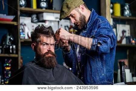 Hipster Lifestyle Concept. Barber With Clipper Trimming Hair On Temple Of Client. Hipster Client Get