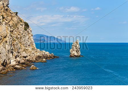 Summer. A Lonely Rock In The Sea.