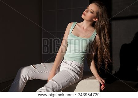 Beautiful Woman With Make-up And Hairdo Sitting In The Bright Clothes 1