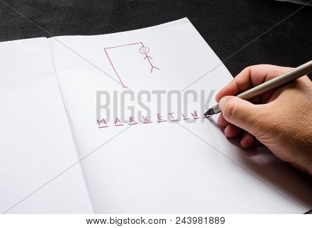 Hangman Traditional Game. Hand With Marker, Highlighter Writes Word Marketing