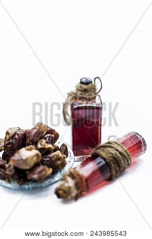 Sweet And Floral Essence Of Date Or Khajoor In Bottles Isolated On White Used In Flavored Chocolate
