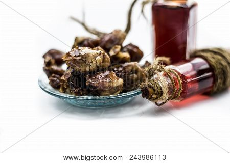 Sweet And Floral Essence Of Date Or Khajoor In Bottles Isolated On White Used In Flavored Chocolate 