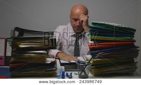 Confident Businessman Reading Contracts And Documents In Archive Room