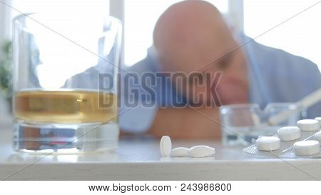 Upset Man Take Medical Pills And Drink Alcohol