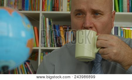 Businessman Image Relaxing In Office Room Drink Coffee Looking To World Map