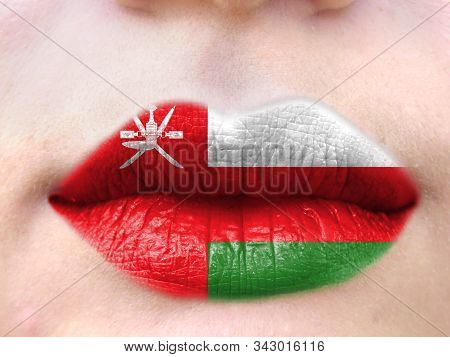 Female Lips Close Up With A Picture Flag Of Oman. Learning Languages.