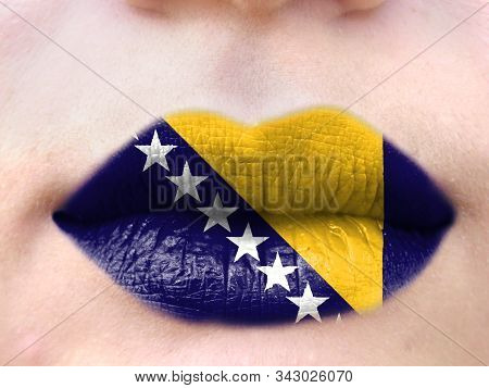 Female Lips Close Up With A Picture Flag Of Bosnia And Herzegovina. Learning Languages.