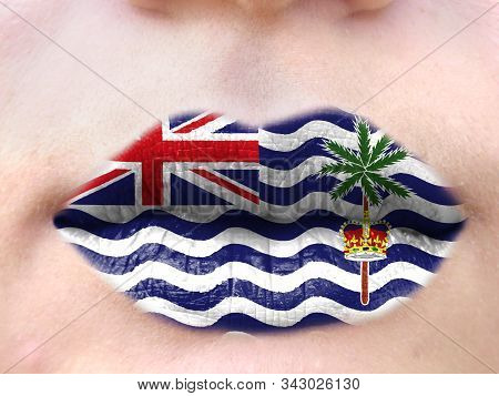 Female Lips Close Up With A Picture Flag Of British Territory In The Indian Ocean. Learning Language