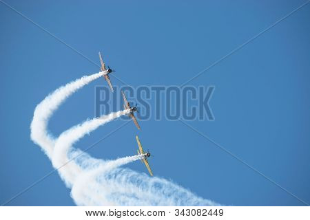 Bucharest/ Romania - Aeronautic Show - September 21, 2019: Yak 52Tw Airplanes Flying Trough The Sky