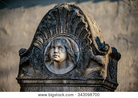 Tombstone With The Face Of A Young Girl At Dorotheenstädtischer Friedhof In Berlin