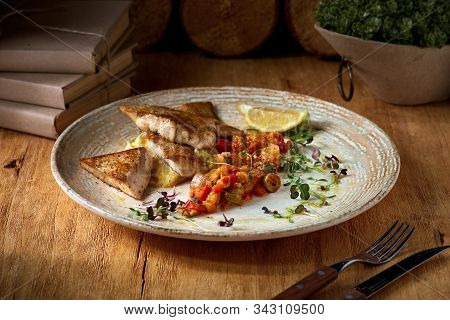 Zander Fish Fillet And Mashed Potatoes, Dish On A Plate On A Wooden Table.