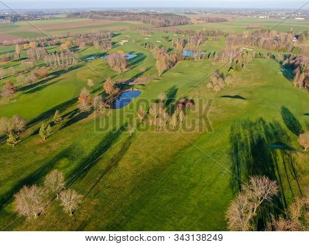 Aerial View Of A Golf Course. Colorful Trees And Green Course During Autumn Season In The South Of B