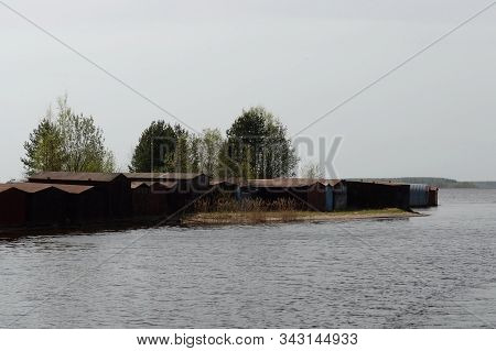 Topornya,vologda Region, Russia - May 11, 2019:garages For Boats On The Shore Tornincasa Channel. Vo