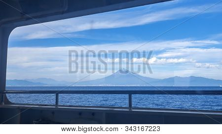 Landscape View Of Fuji Mountain Over Blue Sky And White Cloud From The Ferry Boat In The Ocean At Su