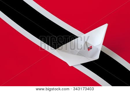 Trinidad And Tobago Flag Depicted On Paper Origami Ship Closeup. Handmade Arts Concept
