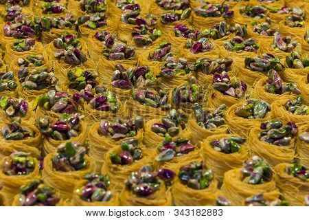Eastern Sweets In A Wide Range, Baklava, , Cashew And Pistachio Nuts On Plates