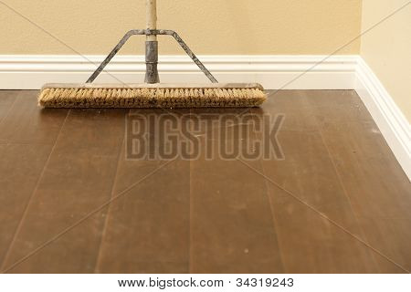 Push Broom on a Newly Installed Laminate Floor and New Baseboards.