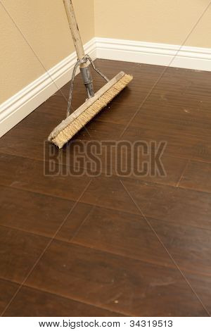 Push Broom on a Newly Installed Laminate Floor and New Baseboards.