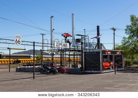 William, Arizona, Usa- 01 June 2015: Art Installation In The City Center, Zipline. Cars And Motorbik