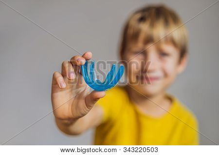 Six-year Old Boy Shows Myofunctional Trainer. Helps Equalize The Growing Teeth And Correct Bite, Dev