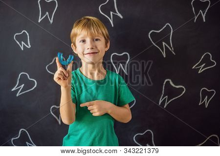 Six-year Old Boy Shows Myofunctional Trainer. Helps Equalize The Growing Teeth And Correct Bite, Dev