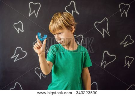Six-year Old Boy Shows Myofunctional Trainer. Helps Equalize The Growing Teeth And Correct Bite, Dev