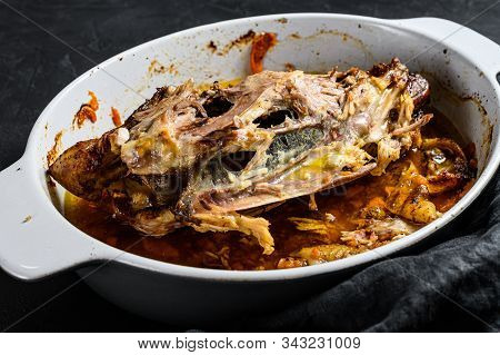 Chicken Skeleton In A Baking Dish. Black Background. Top View