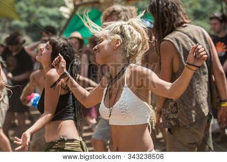 Riomalo De Abajo, Extremadura, Spain - July 16, 2018: A Young Woman Dances On The Front Row Of The M
