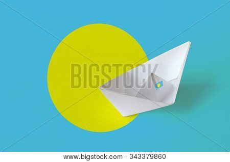 Palau Flag Depicted On Paper Origami Ship Closeup. Handmade Arts Concept