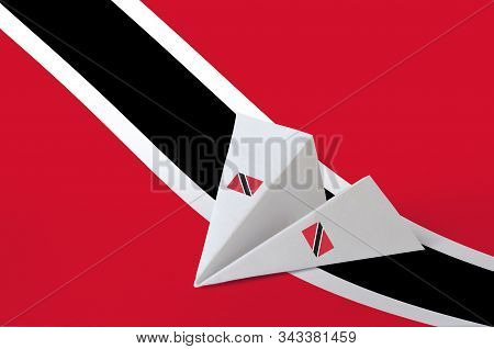 Trinidad And Tobago Flag Depicted On Paper Origami Airplane. Handmade Arts Concept
