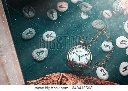 Astrology And Esotericism. On The Dark Surface Lie A Watch On A Chain, Fortune-telling Runestones, A