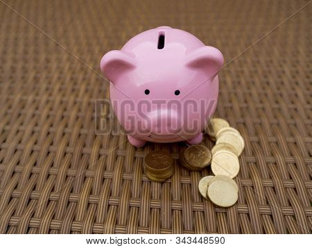 Pink Piggy Bank With Coins Pile, Saving Money For Future Plan And Retirement Fund Concept.
