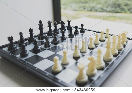 Chess Pieces On Board With White Background, Driven To Success Business Strategy.