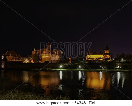 Malbork, Pomerania, Poland - January 1: Castle Of The Teutonic Order In Malbork By Night - The Large
