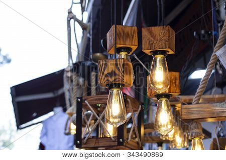 The Lamps Attached To The Yellow Rope Are Used As Decor.