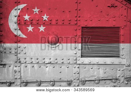 Singapore Flag Depicted On Side Part Of Military Armored Tank Closeup. Army Forces Conceptual Backgr