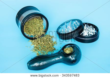 Close Up Of Cannabis - Marijuana Buds, Leaf And Accessories - Grinder, Rolling Papers And Rolled Joi